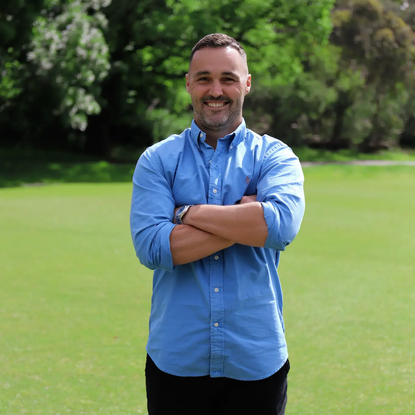 Nick Gieschen with arms crossed smiling