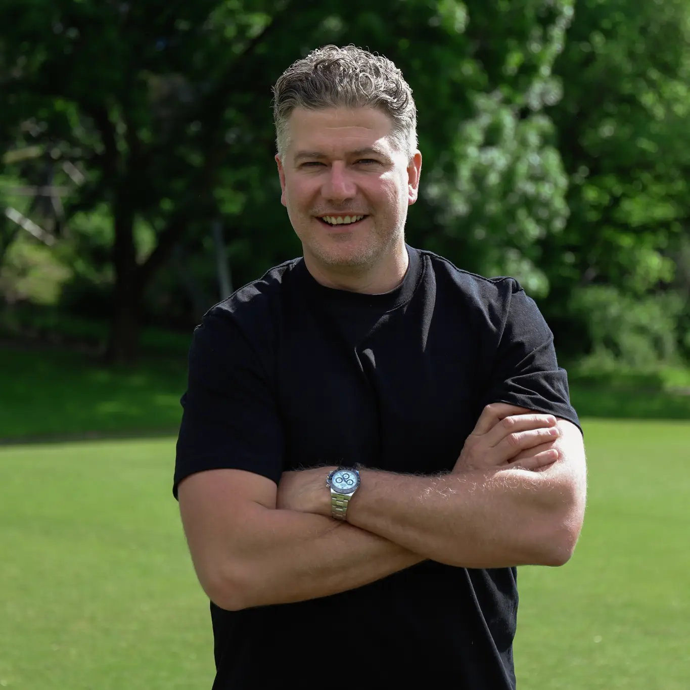 Robbie D'Orazio with arms crossed smiling