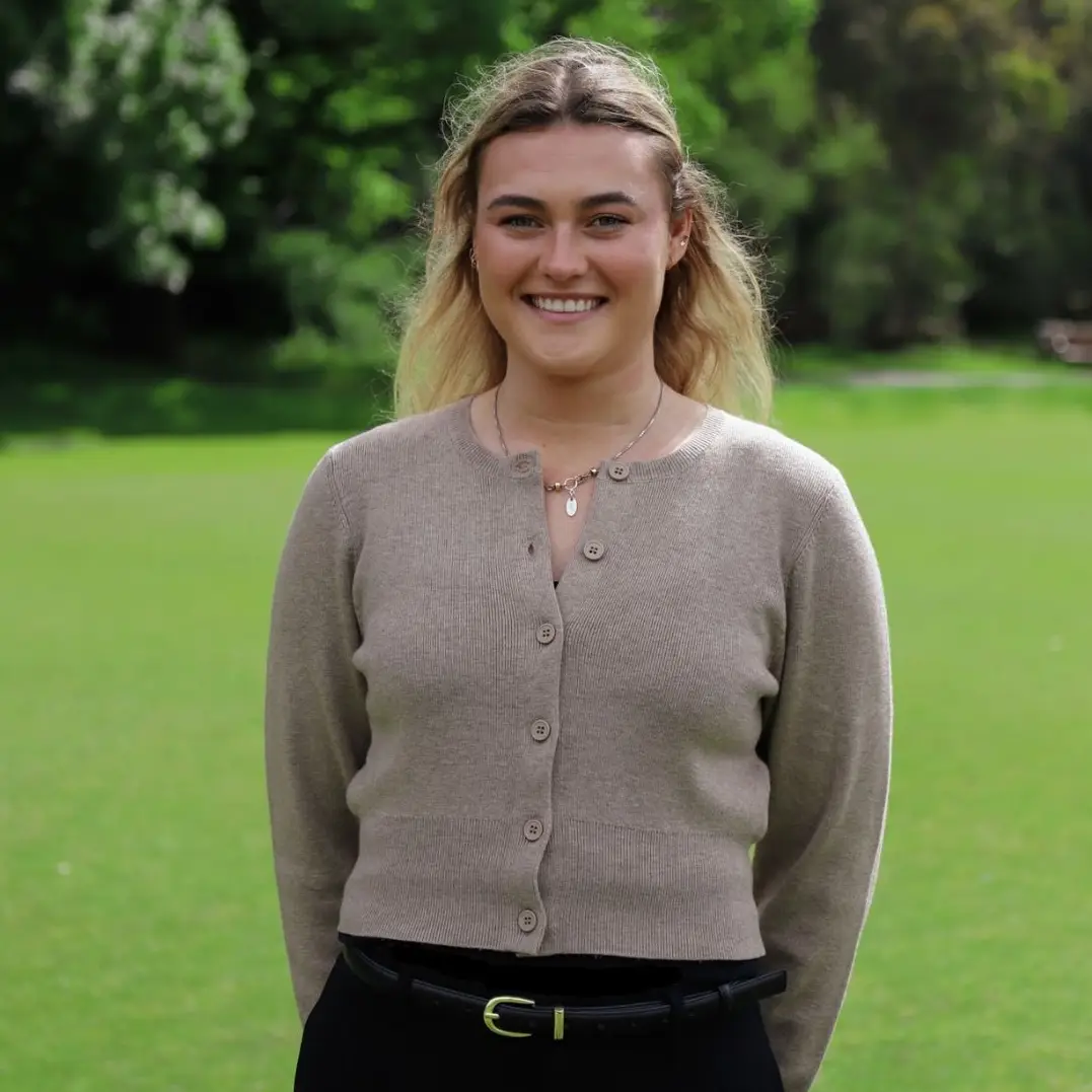 Ruby Richardson hands behind back smiling